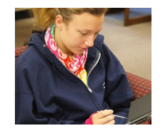 Student checking ESCC alerts on her tablet