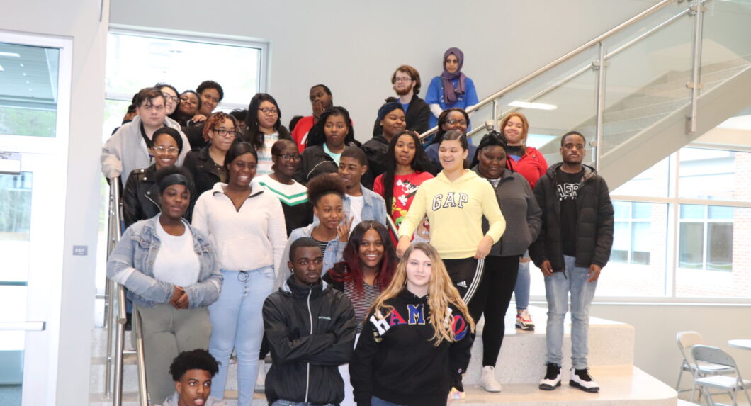 A group of students standing on some stairs