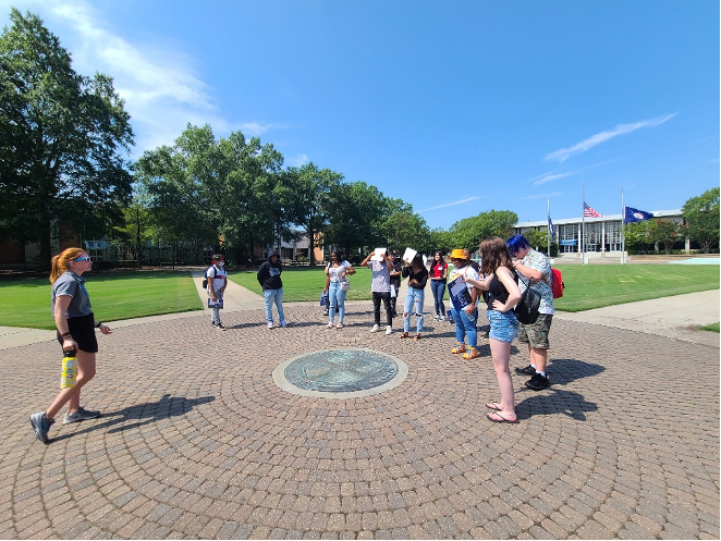 Students gathered in a circle outside