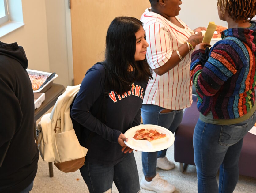 People enjoying pizza