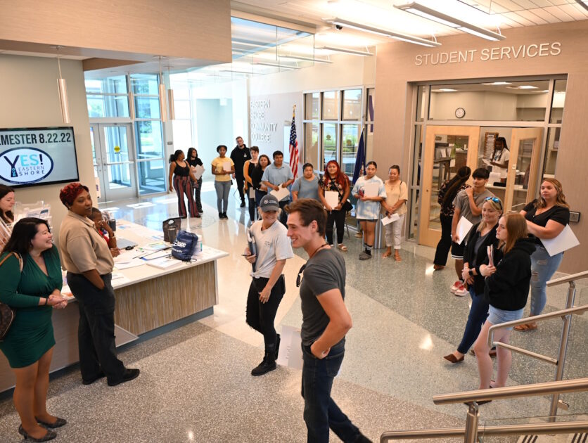 People standing in the hallway outside of ESCC student services