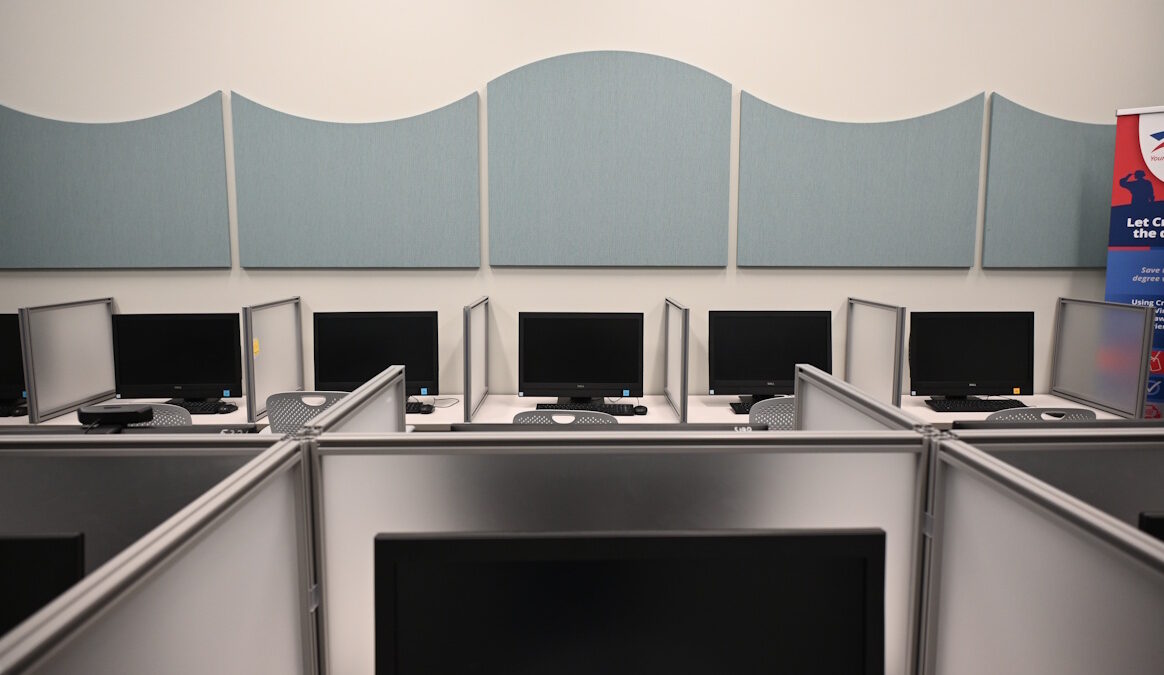 Rows of computer monitors in the ESCC testing center