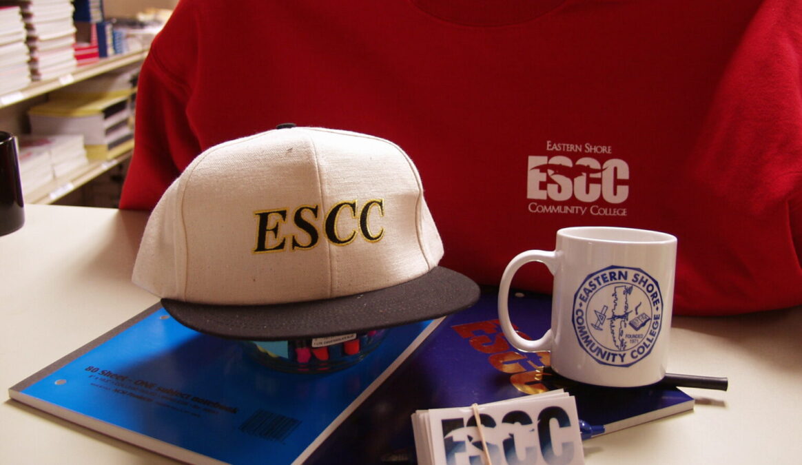 Some ESCC swag including a baseball cap, sweater and mug