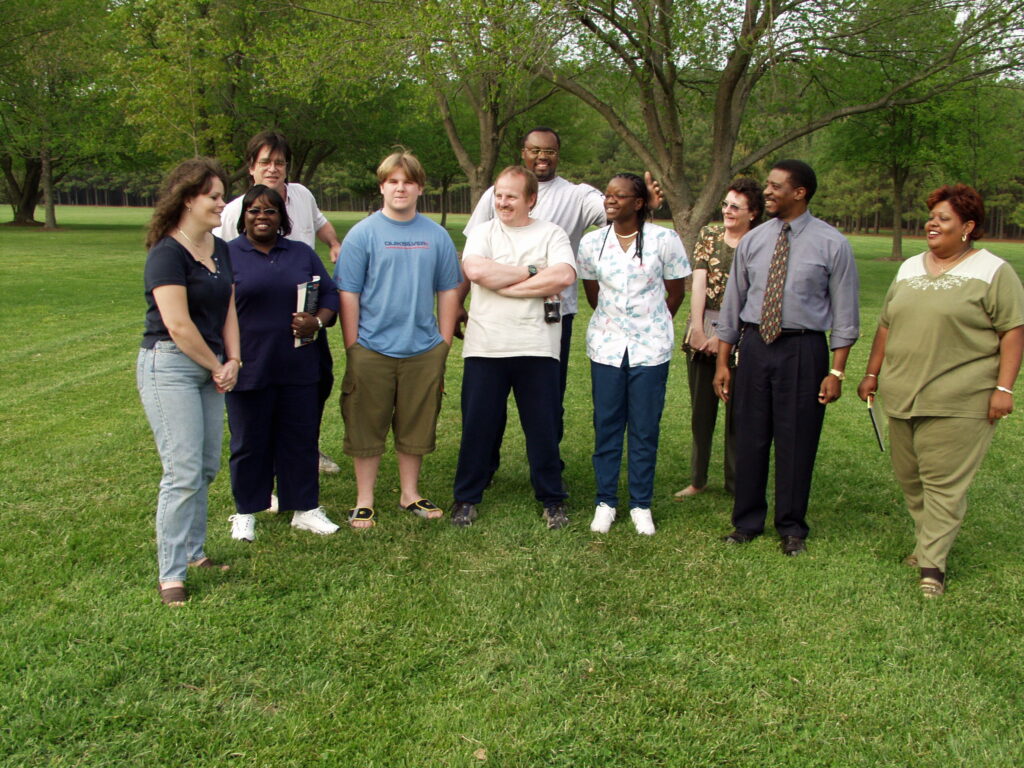 A group of people standing in a field